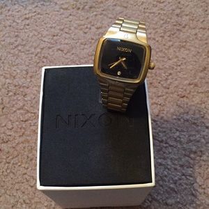 Women’s gold Nixon watch